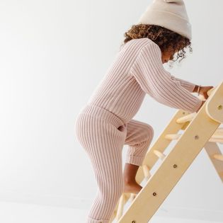 Girl climbing ladder in bamboo sweater set